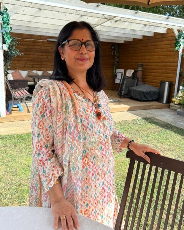 Munna Ghimire smiling in her garden